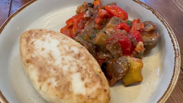 Meat patty with eggplant gravy