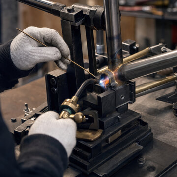 Bicycle Designer Brazing Steel Frame Joint in Fabrication Workshop