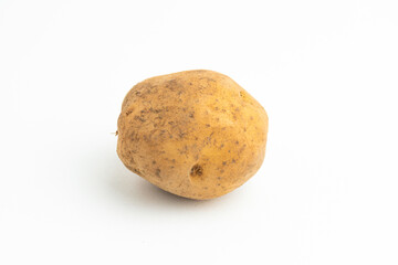 Fototapeta premium Single fresh raw brown baby potato isolated on a white background