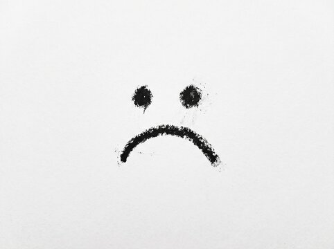 Drawn sad face symbol on white background with emoticon negative expression