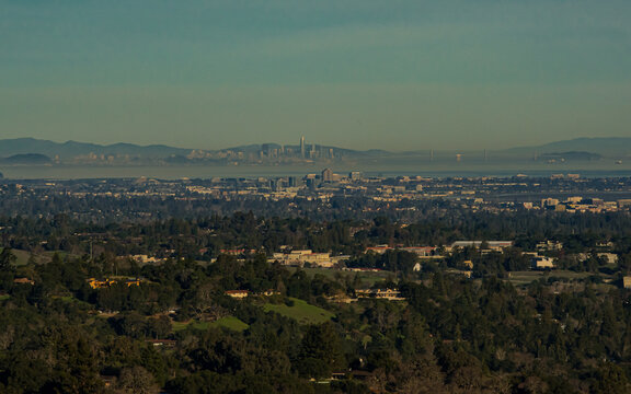A view from the mountain top of Palo Alto Ca. of the surrounding Bay Area cities with the San Francisco skyline in the far background
