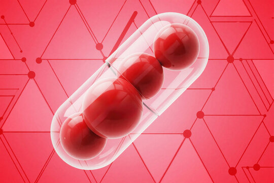 Red spheres inside clear capsule with molecular net pattern. Medical illustration for selenium, vitamin supplements and health science research.