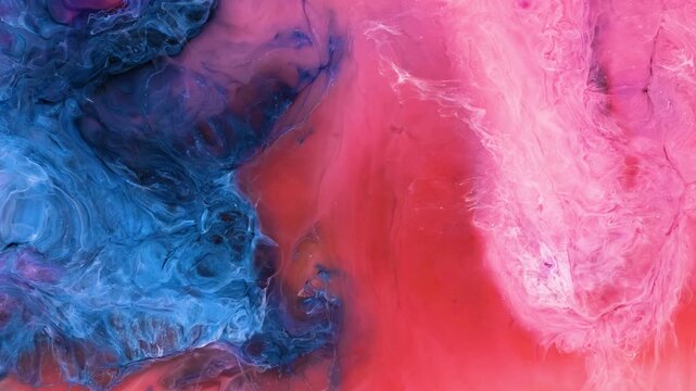 Mixing different colors of alcohol ink in a close-up view
