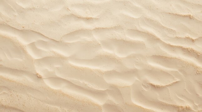 Soft beige sand texture with subtle wave patterns for minimalist design backgrounds and elegant layouts