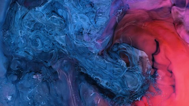 Mixing different colored alcohol inks to create abstract designs
