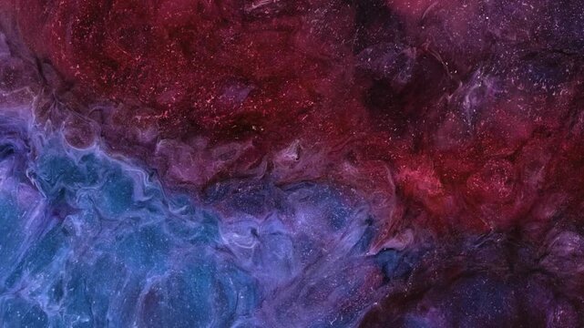 Mixing different colored alcohol inks in a close-up view