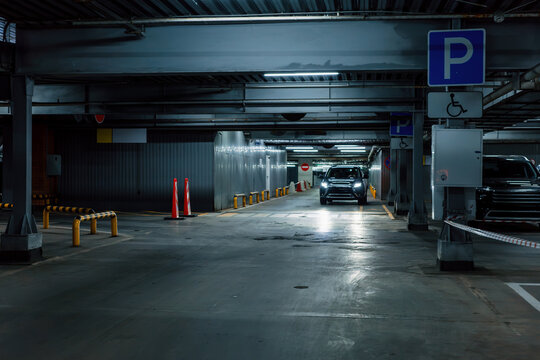 Disabled parking garage with wheelchair sign, accessibility, mobility and car transport in underground interior.