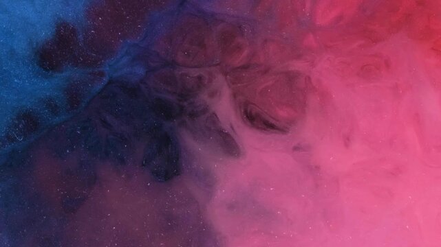Mixing different colored alcohol inks in a close-up view