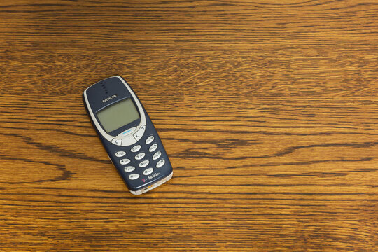 T-Mobile Nokia 3310 mobile phone on a wood table, Sedalia, Missouri, May 2026