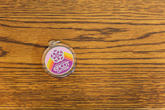 Vintage EPCOT Center keychain on a wood table, Sedalia, Missouri, May 2026