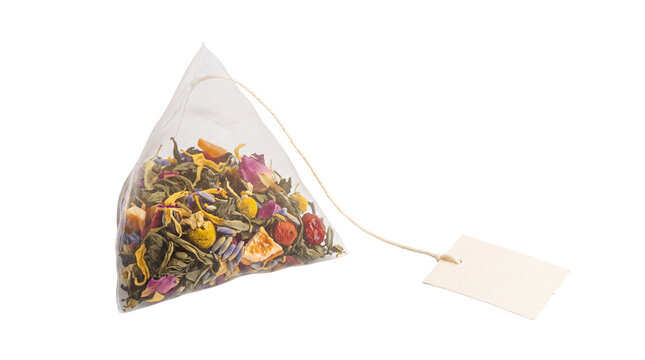 Pyramid tea bag with herbal blend, silk mesh infuser with loose leaf tea and flowers, premium organic tea sachet with blank tag isolated PNG with Transparent Background