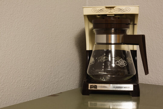 Vintage drip coffee maker on a desk, Sedalia, Missouri, August 2026
