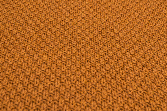 Brown knitted fabric pattern.