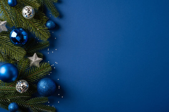 Blue Christmas ornaments and fir branches for Merry Christmas and Happy New Year seasonal greeting