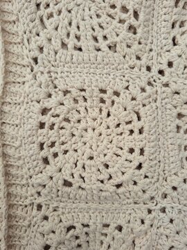 Detailed close-up of a single handmade crochet granny square motif 