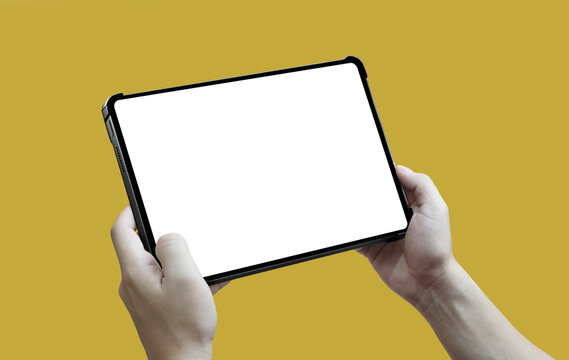 User hands holding a tablet with a protective case and white screen isolated on a yellow background