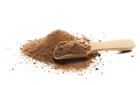 Pile ground chocolate, powder in wooden spoon isolated on white background, side view, clipping path