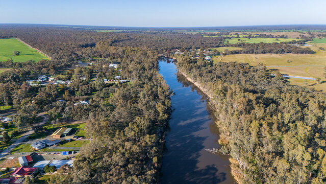 Barmah in Victoria, Australia - Aerial image of the rural township surrounded by dense eucalyptus woodland, with the Murray River, a water tower in Northern Victoria