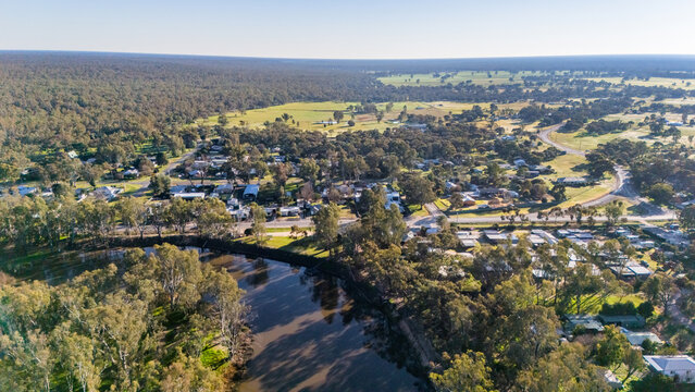 Barmah in Victoria, Australia - Aerial image of the rural township surrounded by dense eucalyptus woodland, with the Murray River, a water tower in Northern Victoria