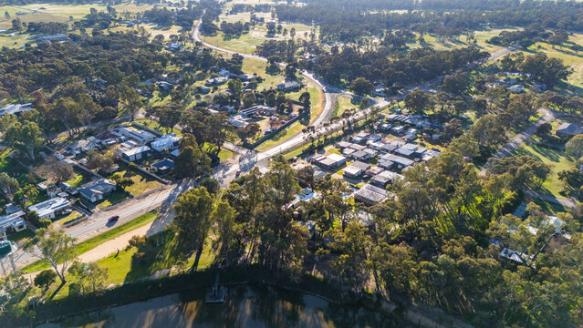 Barmah in Victoria, Australia - Aerial image of the rural township surrounded by dense eucalyptus woodland, with the Murray River, a water tower in Northern Victoria