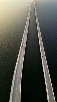 Drone flying over Progreso Pier bridge in Mexico at sunrise