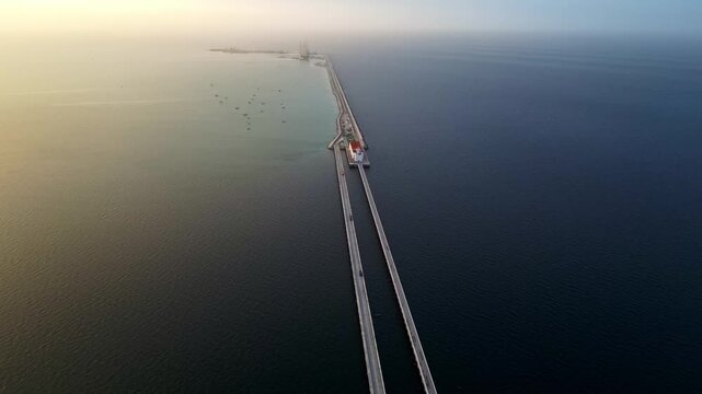 Aerial drone flying over Progreso Pier in Mexico at sunset