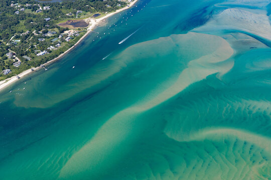 The Atlantic Ocean washes against the beautiful coast of Orleans on Cape Cod, Massachusetts. This outer Cape is a popular east coast vacation destination during summer months.