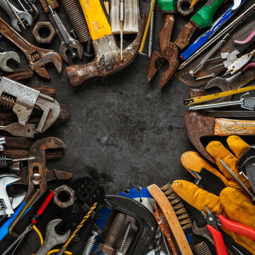 Group of worn work tools. Collection of used and dirty blue collar work equipment. For home improvement, diy repair projects, manual labor jobs, Father's day gift ideas, or to celebrate Labor Day.