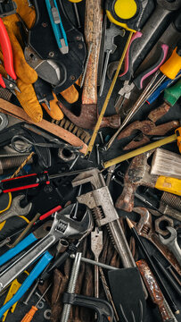 Group of worn work tools. Collection of used and dirty blue collar work equipment. For home improvement, diy repair projects, manual labor jobs, Father's day gift ideas, or to celebrate Labor Day.