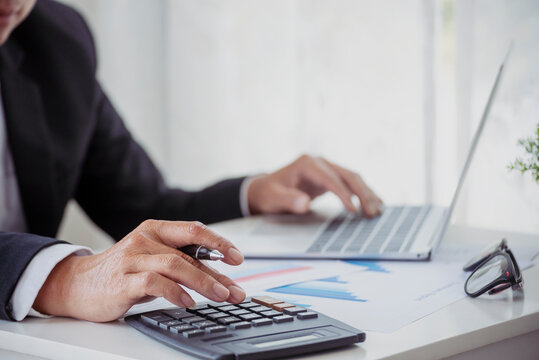Close up businesswoman hands audit accountant using calculator. business graph chart working at home office. Woman Hands working home do accounting small business. Audit Businesswoman at office desk