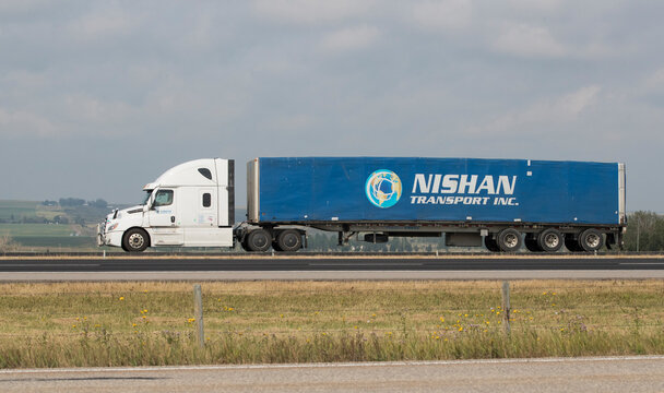 Heavy Cargo on the Road. August 10, 2026. Airdrie, Alberta, Canada. A truck hauling freight along the Queen Elizabeth II Highway near Airdrie, Alberta, Canada. 