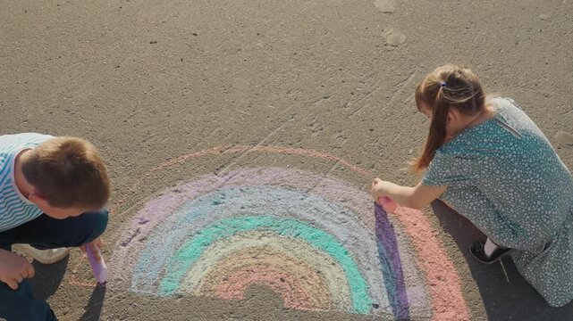 Kid child baby boy girl Sidewalk creation moment, small artists at play, making a rainbow, brother and sister drawing, pastel hues on street, artist duo, chalk art joy, summer sketch project, creative