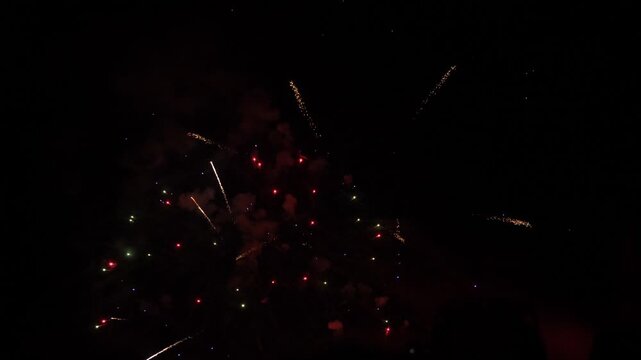 joyful fireworks moment, new year&rsquo;s fireworks celebration, joyful celebration captured in the shimmering explosion of fireworks, fireworks ignite sky, grand finale of celebration with fireworks