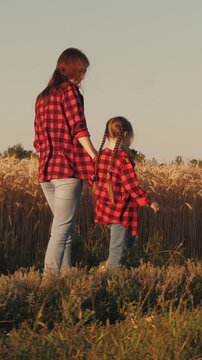 child girl daughter kid holding hand farmer mother, agriculture, business wheat field, friendly family, mother farmer holding her daughter hand wheat field, hands parent child, farmer with child
