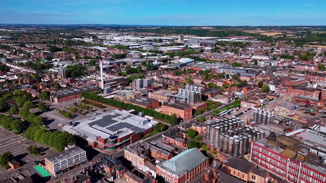 High aerial drone view of Burton upon Trent town center and breweries