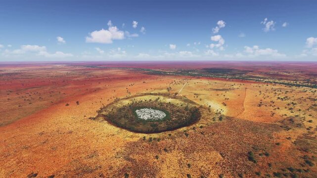 Circular aerial drone view of Wolfe Creek Meteorite Crater. Australia