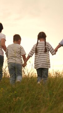 Happy family girl boy mother father walking field , Parents and children enjoying sunset together, Family girl boy mother father bonding outdoors, Family time nature, Togetherness love countryside