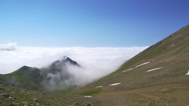 Zagros Iran mountain peaks rise above clouds with rugged ridges and high altitude drama.