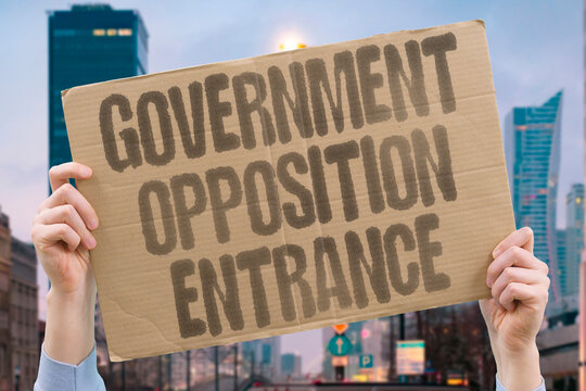 "Government Opposition Entrance" Government and opposition MPs gather at the same parliament entrance, fighting over who controls the narrative. GOVERNMENT. OPPOSITION. ENTRANCE. NARRATIVE. CONTROLS.