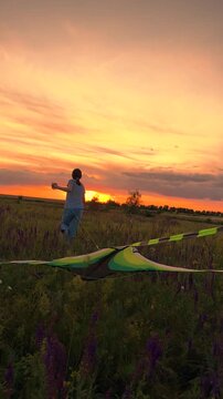 child girl running sunset flying kite, silhouette children game, Expanse of green and purple, orange hue in the sky, flying my favorite kite, evening solitude, fields of freedom, sunset delights
