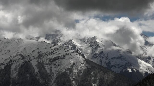 Snowy Eastern Black Sea Mountains in Rize Turkey rise above forests and cloud valleys.