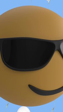 Face wearing sunglasses emoji over multiple white balloons icons floating against blue background