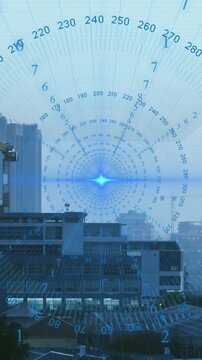 Animation of data processing spinning around blue light spot against aerial view of cityscape