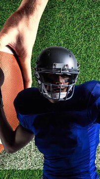 Animation of american football player with ball on pitch background