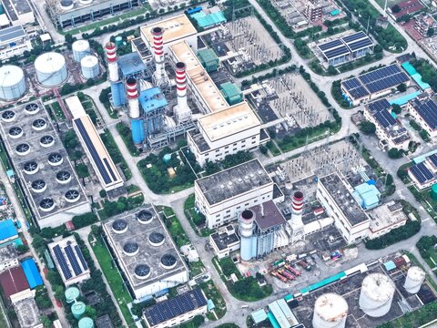 Aerial view of Sirajganj Power Station with industrial buildings, cooling towers, and storage tanks in Sirajganj District, Rajshahi Division, Bangladesh.