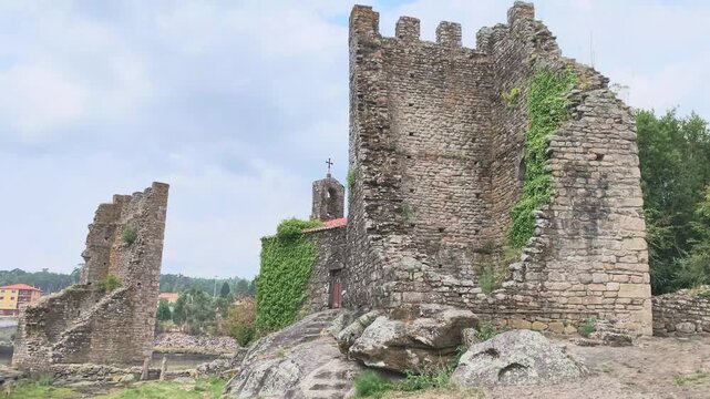 Medieval west towers ruins in catoira spain. Ancient stone ruins of the torres de oeste, a medieval castle complex in catoira, galicia, with a historic chapel nestled among the fortifications 