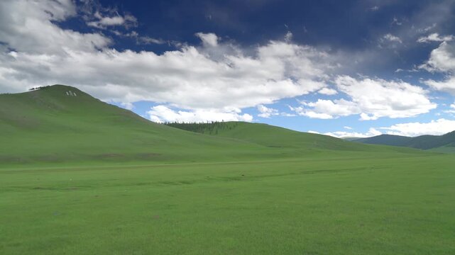 Mongolia mountain hillside marked by white stone Soyombo symbol, national emblem landscape.