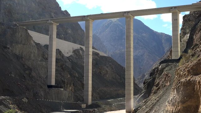 Artvin mountain highway bridge spans rocky valley beside tunnel entrance and steep gorge.