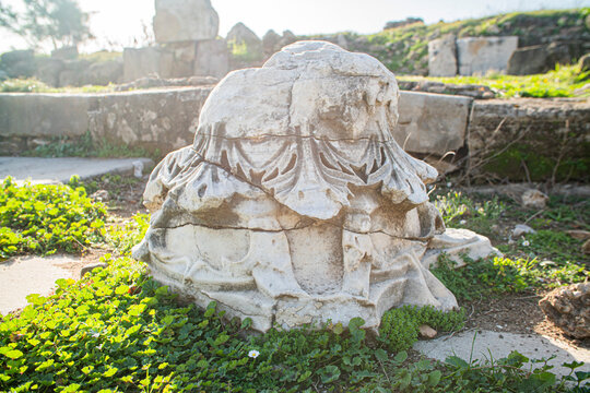 Ornate ancient Roman marble column capital with floral carved relief  archaeological site in Turkey