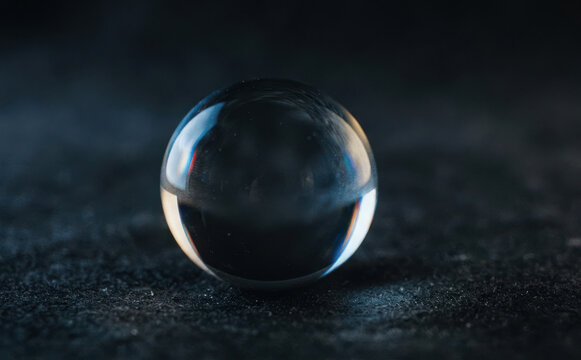 Crystal ball on dark textured background representing divination future prediction and mysticism concept for esoteric photography